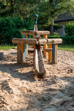 Play equipment in a wooden bottle box where you can play with sand and water in the sunの写真素材