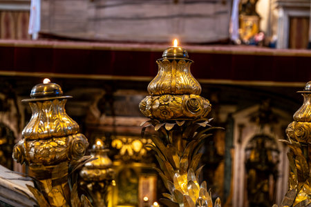 CittÃ  del Vaticano, Vaticano - Stato della CittÃ  del Vaticano - 11-22-2022: Golden candlesticks with burning flames adorn the altar in the sacred heart of St. Peter's Basilicaのeditorial素材