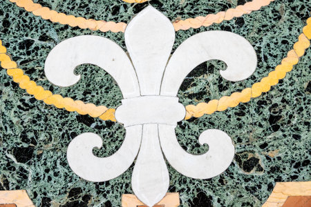 CittÃ  del Vaticano, Vaticano - Stato della CittÃ  del Vaticano - 11-22-2022: A close-up of the intricate fleur-de-lis design embedded in the green marble floor of the Vatican Museums, showcasing artistry and historyのeditorial素材