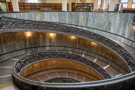 CittÃ  del Vaticano, Vaticano - Stato della CittÃ  del Vaticano - 11-22-2022: An exquisite spiral staircase with detailed ornamentation winds elegantly inside the Vatican Museumsのeditorial素材