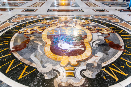 CittÃ  del Vaticano, Vaticano - Stato della CittÃ  del Vaticano - 11-22-2022: The opulent mosaic floor in St. Peter's Basilica, featuring Pope Innocent XI's coat of armsのeditorial素材