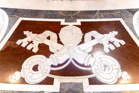 CittÃ  del Vaticano, Vaticano - Stato della CittÃ  del Vaticano - 11-22-2022: Elegant inlay of the papal tiara and keys on the floor of St. Peter's Basilica signifies authorityのeditorial素材