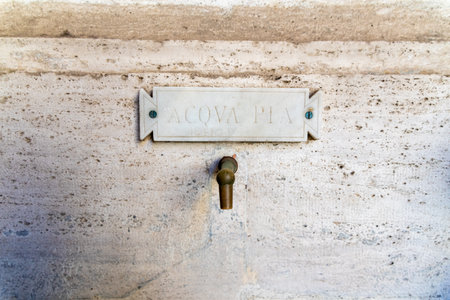 CittÃ  del Vaticano, Vaticano - Stato della CittÃ  del Vaticano - 11-22-2022: Historic 'ACQUA PIA' marked water spout, a staple of Vatican hydrationのeditorial素材