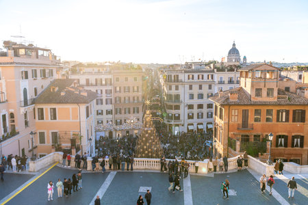 Roma, Lazio - Italy - 11-27-2022: Late afternoon sun casts a warm glow on Rome's lively Spanish Steps areaのeditorial素材
