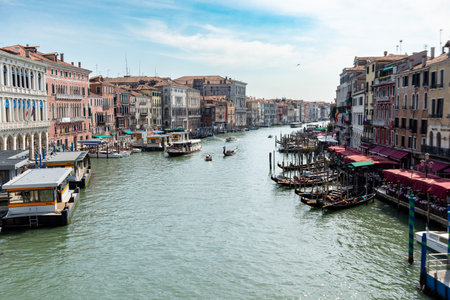 Venice, Veneto - Italy - 06-09-2021: Vibrant view of Venice's Grand Canal teeming with gondolas and...