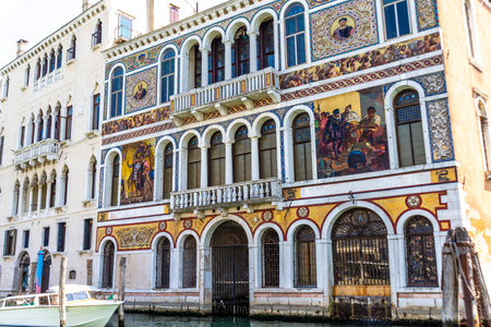 Venice, Veneto - Italy - 06-10-2021: Palazzo Barbarigo unique mosaic facade showcases Venice's artisanal heritage on the Grand Canalのeditorial素材