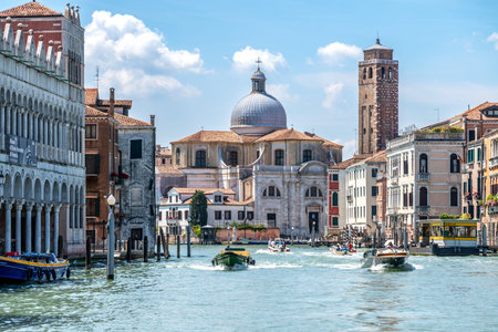 Venice, Veneto - Italy - 06-10-2021: View of San Geremia Church and bustling Grand Canal in Venice
