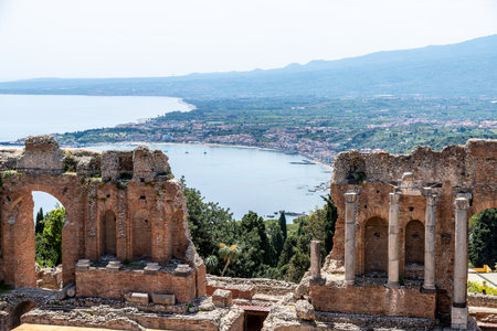 Theatre Ruins Overlooking Coastline in Taorminaの写真素材