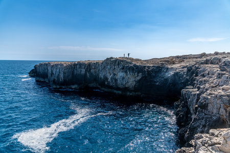 Rocky coastline with cliffs and deep blue seaの写真素材