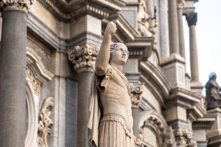 Stone statue on facade of SantAgata Cathedralの写真素材