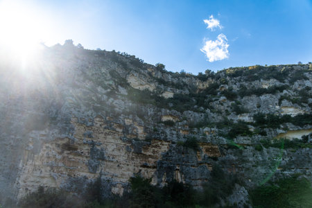 Sunlit rocky cliff face in the valley of Pantalicaの写真素材