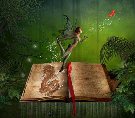 fairy flying over a story book in the forestの写真素材