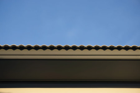 roof under construction with stacks of roof tiles for home building