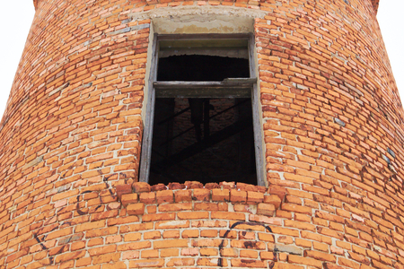 Red brick water tower in the winter morningの写真素材