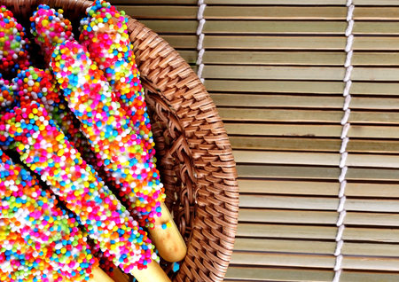 Breadsticks in chocolate on the background.