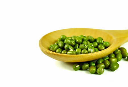 Beans in wood spoon isolated on white backgroundの写真素材