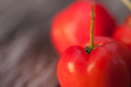 Acerola fruit on wood backgroundの写真素材