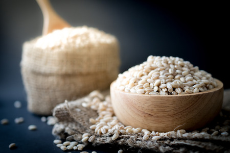 pearls barley grain seed on backgroundの写真素材