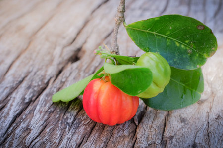 Acerola fruit on wood background