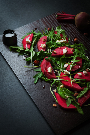 beetroot salad, with goat cheese, hazelnut and rocket leaves.の写真素材
