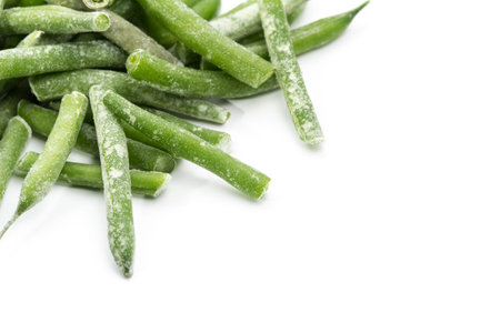 Frozen sticks of asparagus. White background. Isolated.