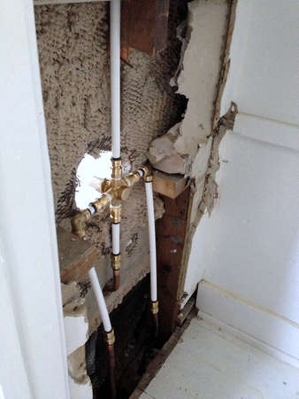 Plumbing repair for a tub and shower combination bathroomの写真素材