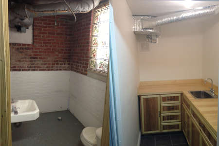 A bathroom repurposed into a darkroom with cabinetsのeditorial素材