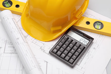 Blueprint, architecture model and pocket calculator in the close-up.の写真素材