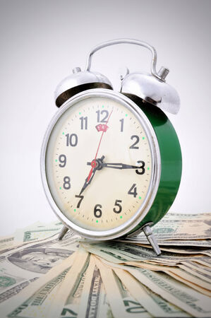 Time is Money Green Old Clock on the white backgroundの写真素材