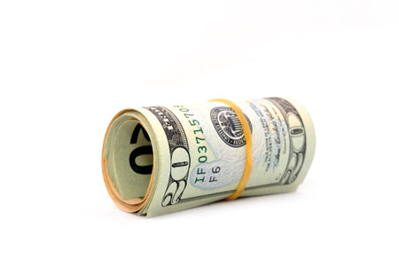 Roll of 20 dollar bills on white background. Isolated on white