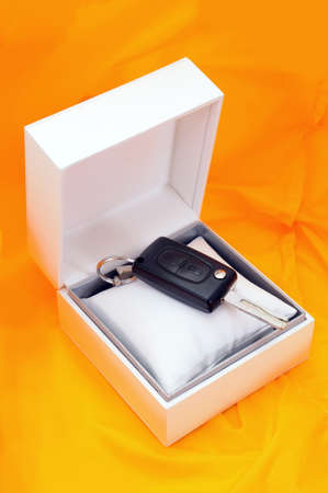 give as a car her gift on the yellow backgroundの写真素材