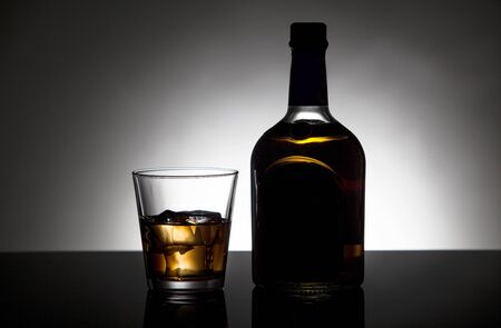 Whiskey bottle and Glass on the dark backgroundの写真素材