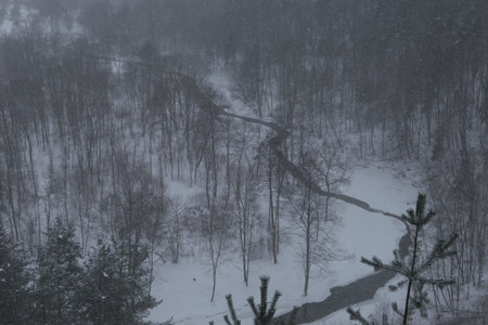 Aerial panoramic foggy view from the top of Puckoriai mound in winter in Lithuania. Snow covered...