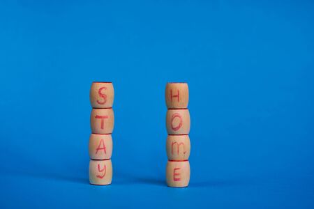 Stay Home, words and mercury thermometer on blue background.の写真素材