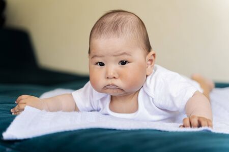 a newborn baby is for advertising. surprised face.の写真素材