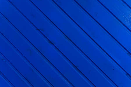the surface of the wooden slats is painted blue.の写真素材