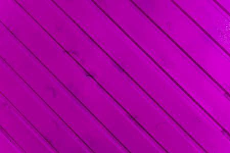 the surface of the wooden slats is painted pink.の写真素材