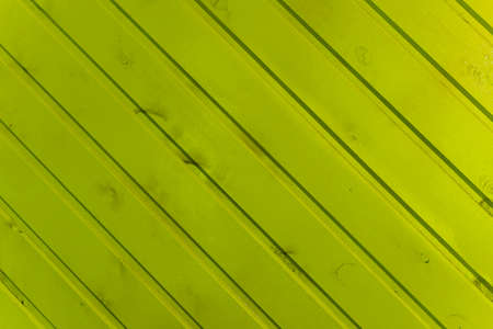 the surface of the wooden slats is painted yellow.の写真素材