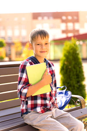 A small child with a book went to school during the pandemicの写真素材