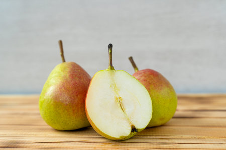 fresh juicy delicious pears on a wooden background