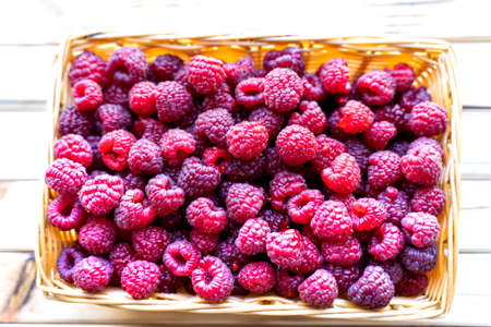 ripe juicy raspberries close-up. step-by-step instructions on how to prepare raspberriesの写真素材