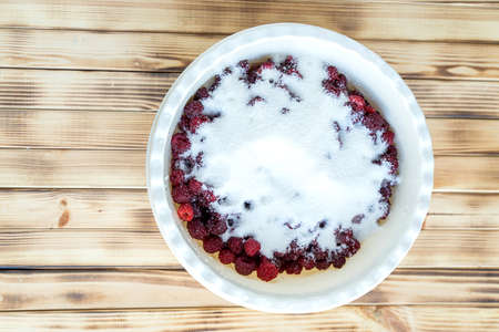 fresh juicy ripe raspberries covered with sugarの写真素材