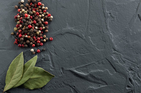 bay leaf and pepper on a dark backgroundの写真素材