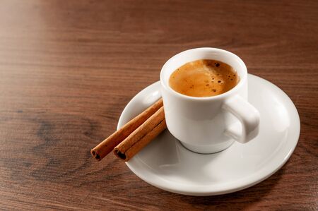 cup of coffee with cinnamon sticks. Top view and close-upの写真素材