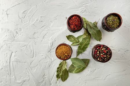 bay leaf, pepper and spice on white texture background top viewの写真素材