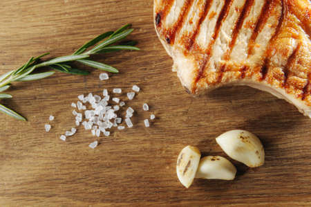 steak fried coarsely and close with salt and baking, top view and flat layの写真素材