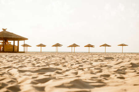 Beach Chairs and Umbrella on a beautiful island, panoramic view with much copy spaceの写真素材