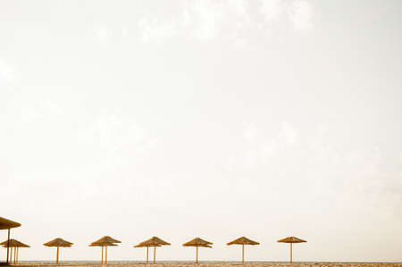 Beach Chairs and Umbrella on a beautiful island, panoramic view with much copy spaceの写真素材