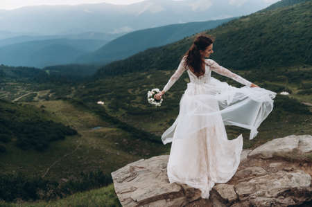 Walk the bride. A light and airy dress flutters in the wind.の写真素材