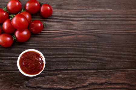 tomato sauce on a wooden background. top view.の写真素材
